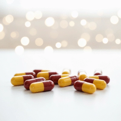 African mango capsules on a clean white surface with a blurred background, no text, no words, no typography, 8K, natural lighting